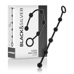 Chapelet anal Korg en silicone noir avec son emballage de présentation