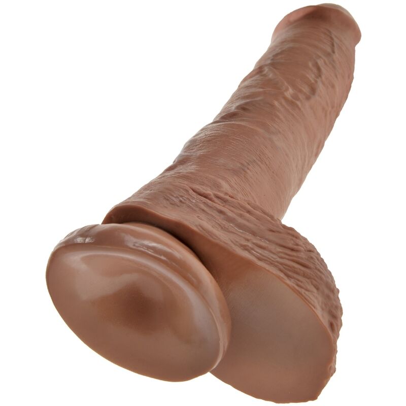 Vue rapprochée de la ventouse et des testicules du gode King Cock