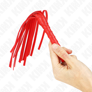 Mini martinet rouge tenu en main montrant le faisceau de fines bandes mobiles