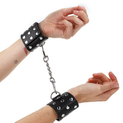 Menottes Kink noires cloutées à pressions, réglables 19–24 cm × 5,5 cm