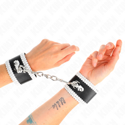 Menottes bondage dentelle blanche sur simili noir
