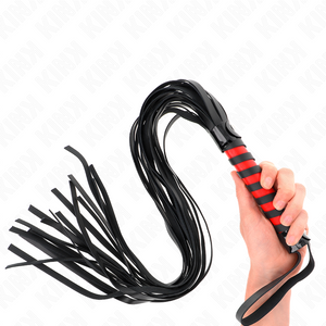 KINK flogger held in one hand, with a red and black spiral handle, long black tails and strap around the wrist