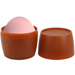 Œuf masturbateur rose sortant de son récipient de rangement