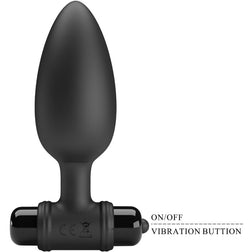 Plug anal noir de 11,8 cm tenu en main pour montrer les proportions
