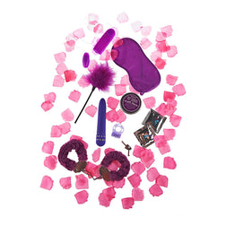 Coffret ToyJoy Super Sex Bomb violet avec vibromasseur, bougie et accessoires, vue de face