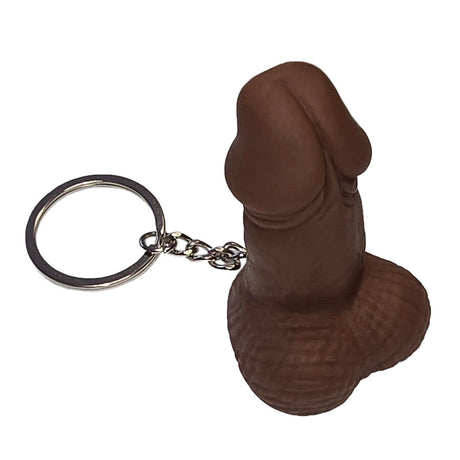 Brown penis whistle keyring with a silver ring on a white background.