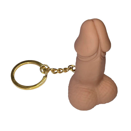 Flesh-coloured penis whistle keyring with a gold ring on a white background.