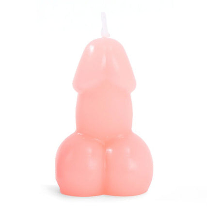 Pink wax penis candle with a wick on a white background.