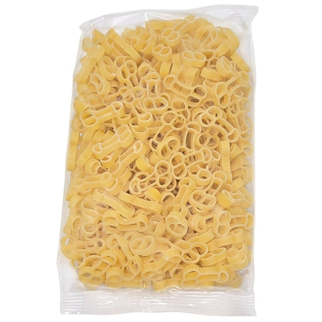 Sachet transparent rempli de pâtes crues en forme de pénis