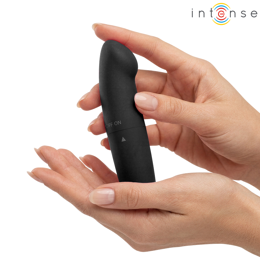 Mini-vibrateur Phil noir tenu entre deux mains, avec sa tête légèrement incurvée