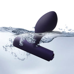 Waterproof butt plug emerging from water with splashes
