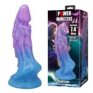 Gode monstre Atlanteans violet et bleu posé à côté de sa boîte Power Monsters