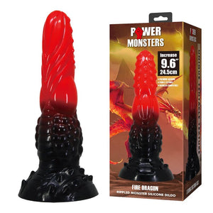 Gode monstre Fire Dragon rouge et noir posé à côté de sa boîte Power Monsters