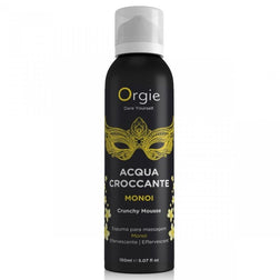 Flacon aérosol noir à décor jaune Orgie Acqua Croccante Monoi 150 ml, vu de face sur fond blanc