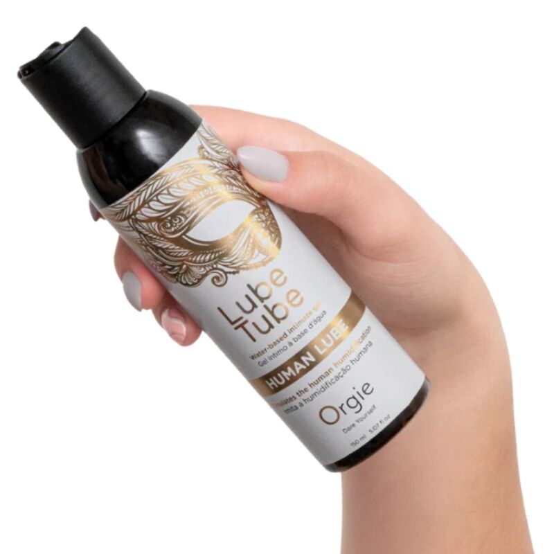 Flacon de lubrifiant Human Lube ORGIE tenu dans une main