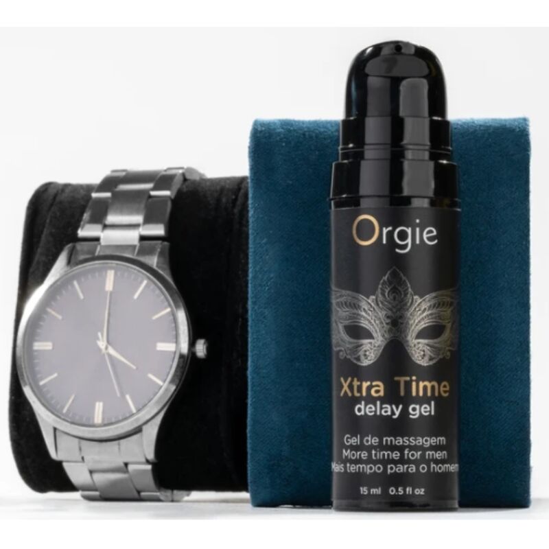 Flacon Xtra Time Delay Gel 15 ml Orgie posé devant un support bleu, à côté d'une montre