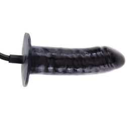 Vue rapprochée du gode gonflable en latex noir veiné